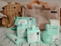 Cesta de elefante con productos Suavinex: toallitas, gel-champú, loción corporal, crema del pañal y colonia. Un set imprescindible para bebé.