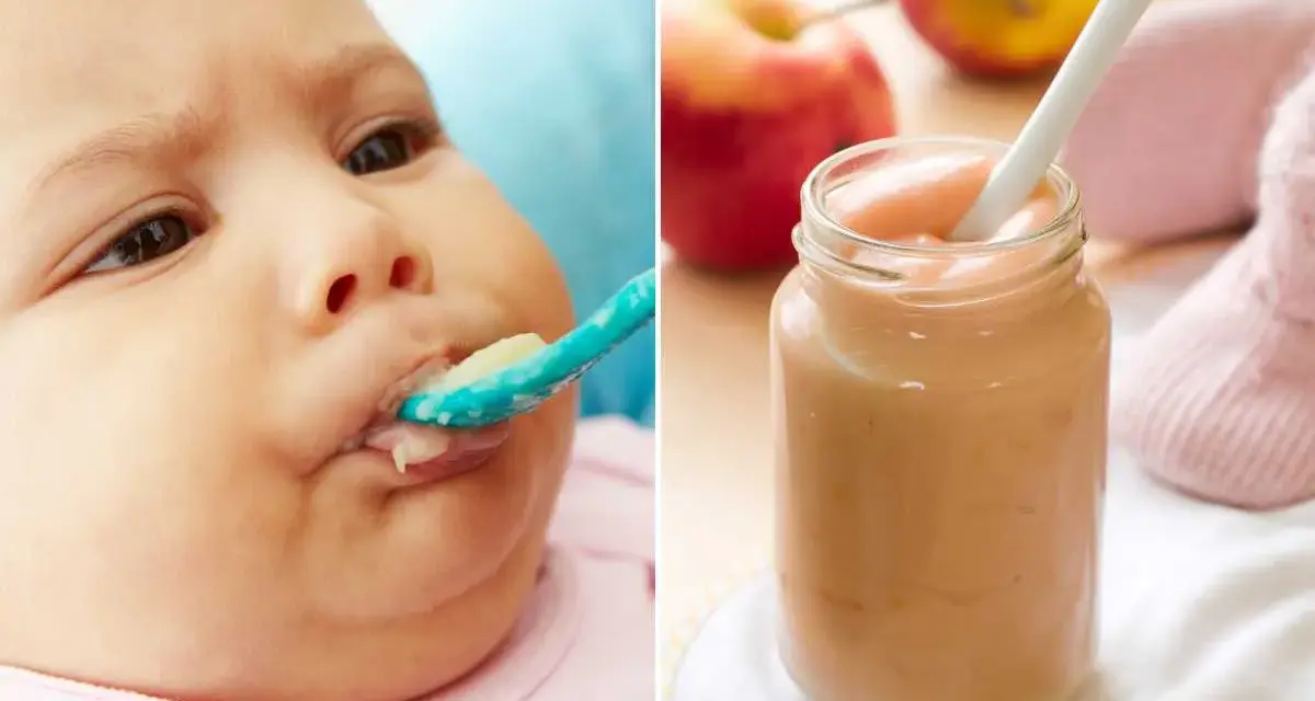 Bebé de 4 meses probando su primera fruta. Puré de manzana en un tarro y una cuchara.