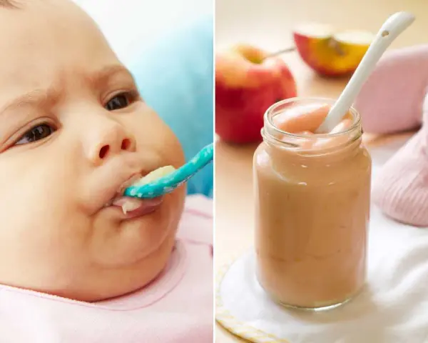 Bebé de 4 meses probando su primera fruta. Puré de manzana en un tarro y una cuchara.